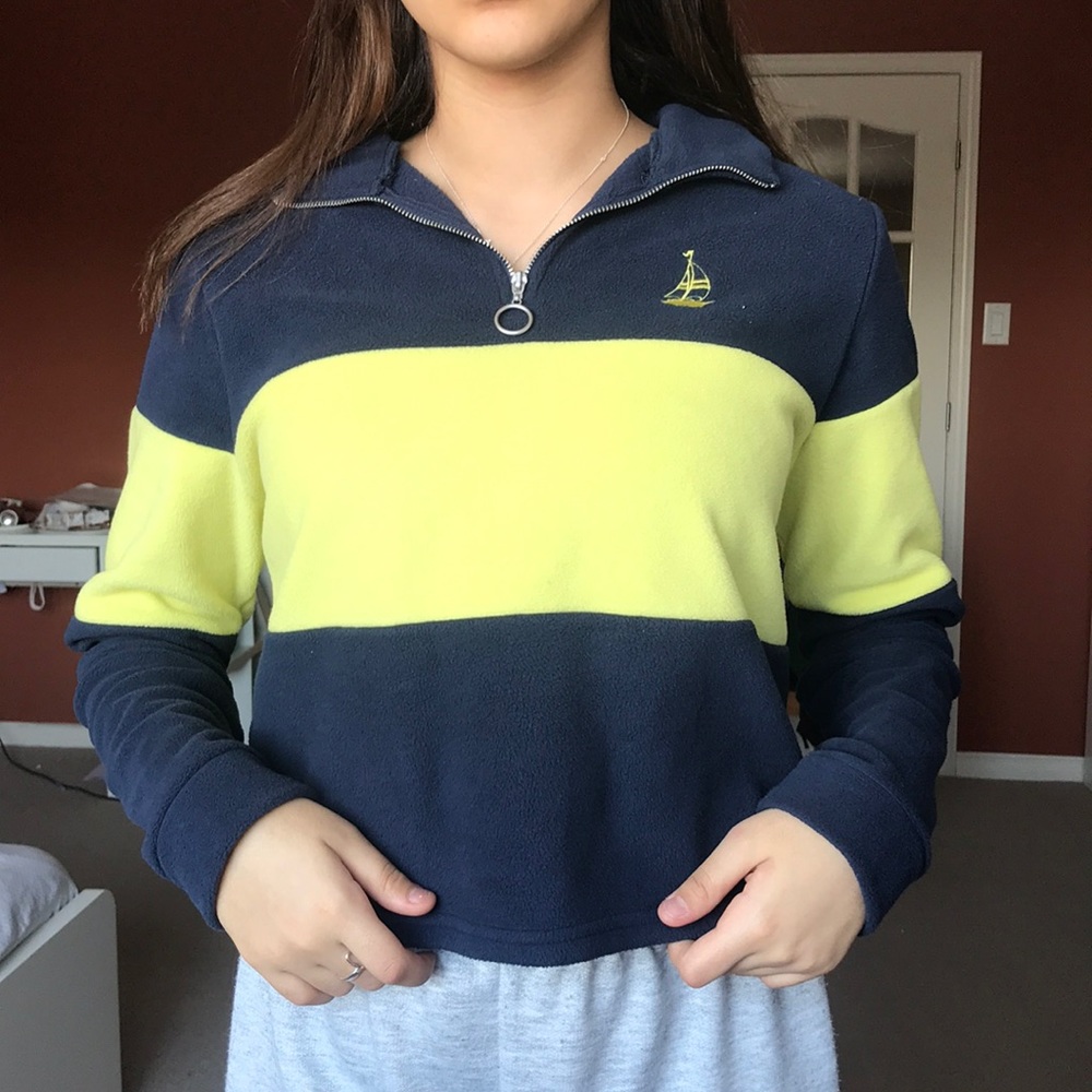 A blue and yellow sweatshirt from Twik (Simons)